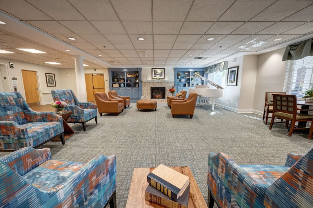 A cozy lounge area with comfortable seating and a fireplace.
