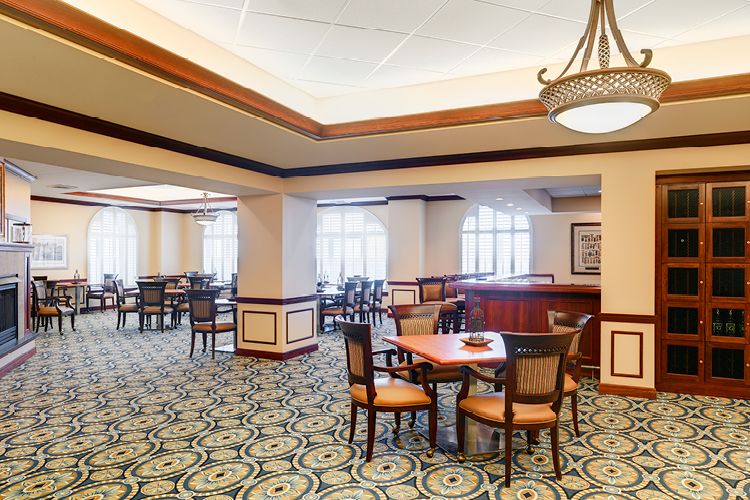A spacious dining area with elegant decor and comfortable seating.