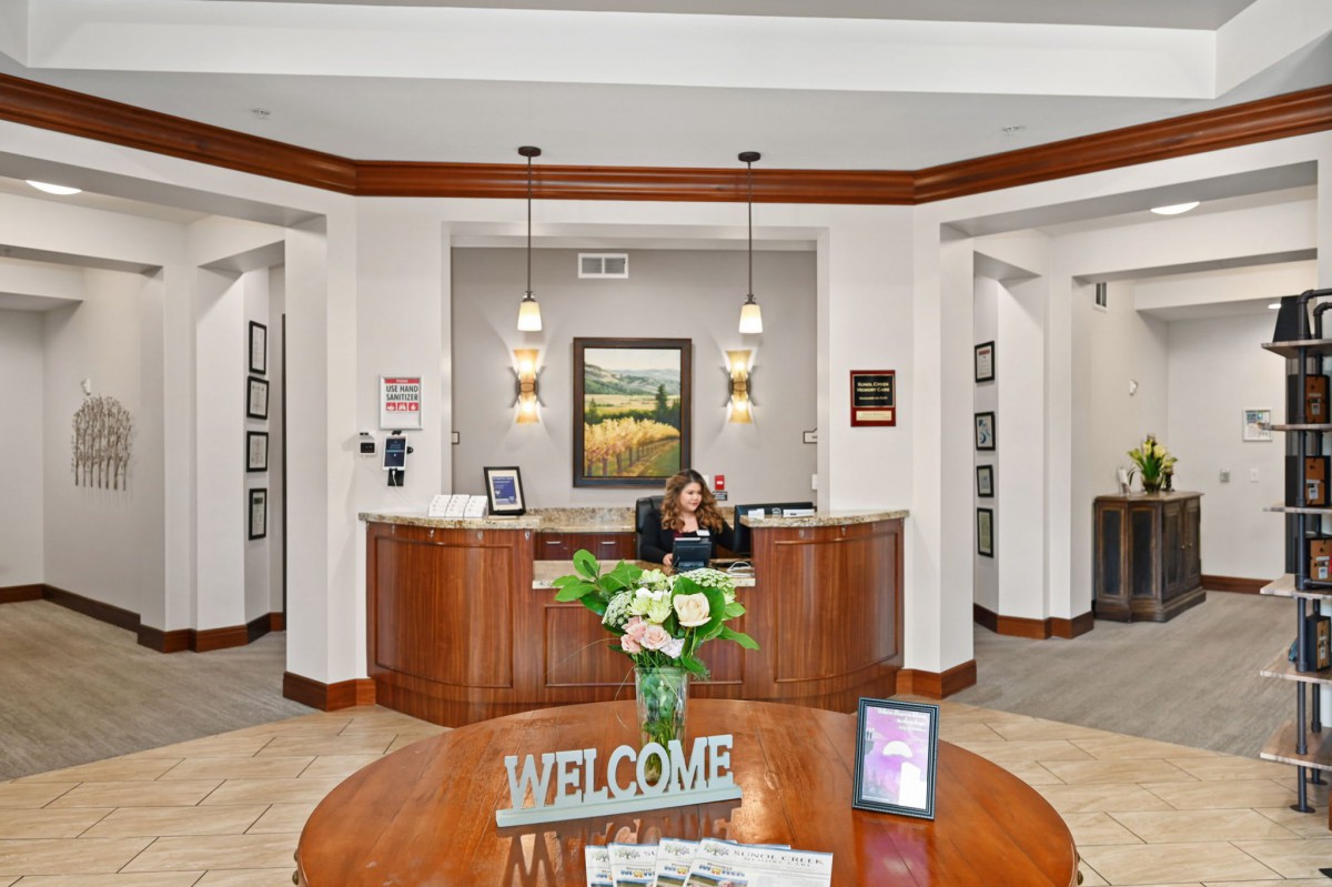 A welcoming reception area with a front desk and decorative elements.