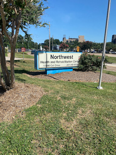 A sign for Northwest Health and Rehab Center, indicating a healthcare facility in an outdoor setting.