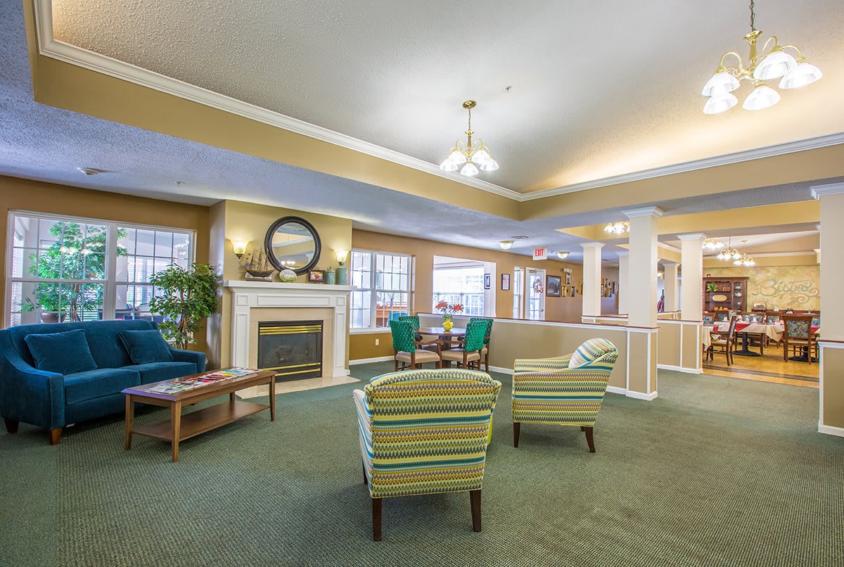 A cozy living room with a fireplace and comfortable seating.