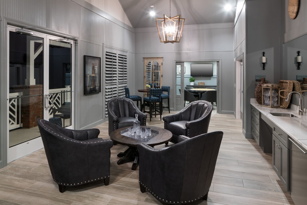 A modern living room with stylish furniture and elegant lighting.