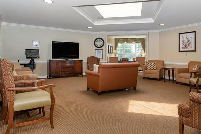 A cozy living room with comfortable seating and a television.