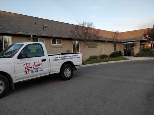 A service truck parked outside a commercial building during the evening.