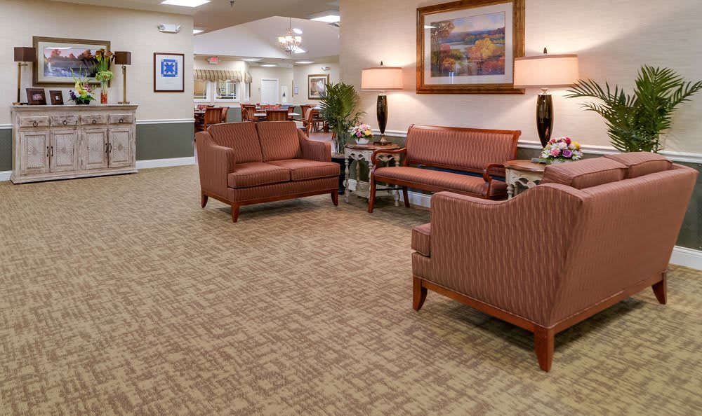 A well-lit lobby with comfortable seating arrangements and elegant decor.