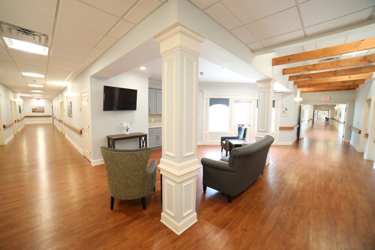 A cozy lounge area with comfortable seating and a television.