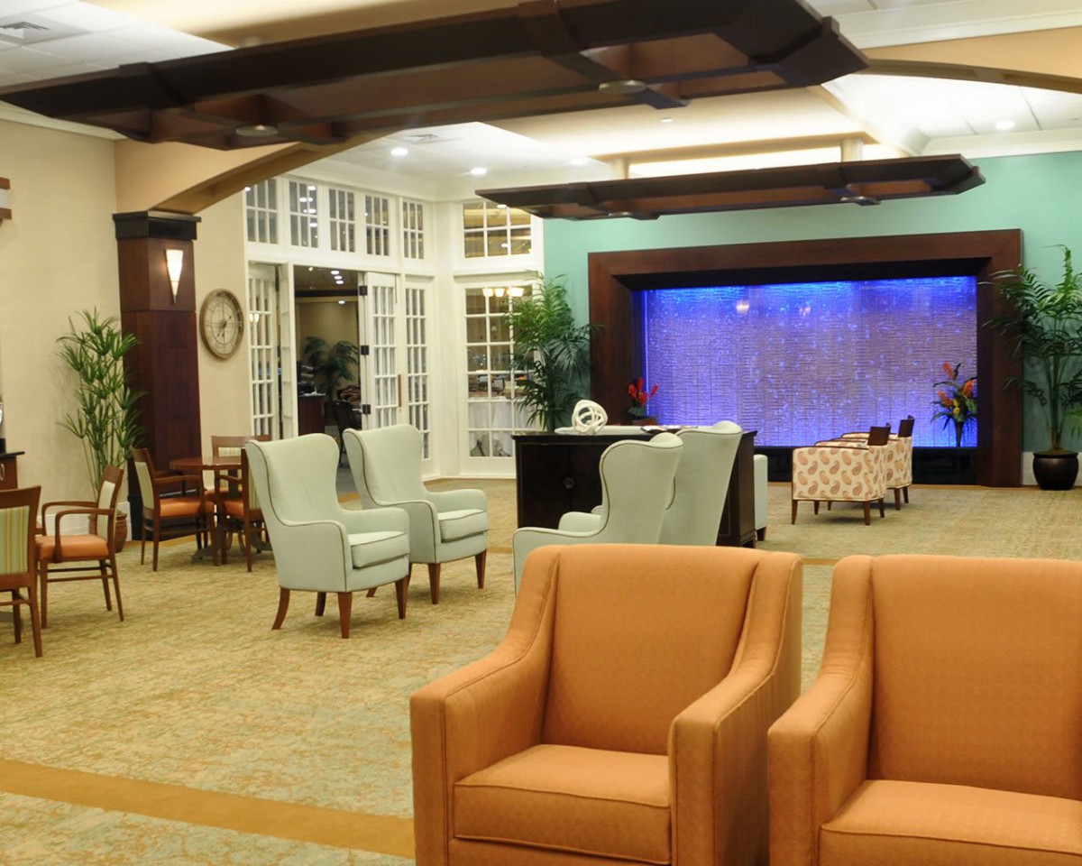 A comfortable lobby area with various seating options and ambient lighting.