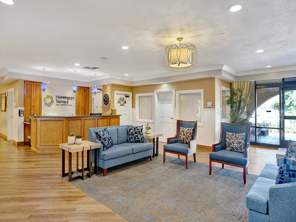 A well-furnished lobby area with comfortable seating and stylish decor.
