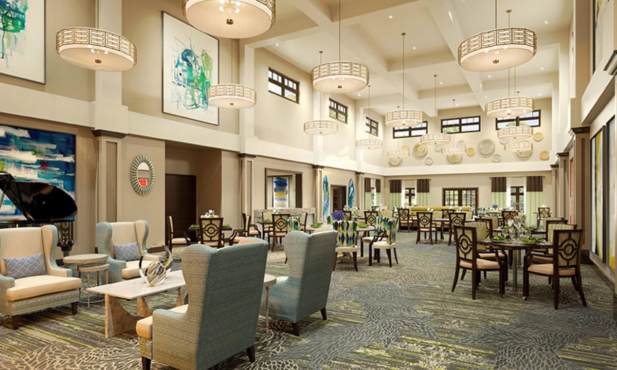 A modern dining area with comfortable seating and elegant lighting fixtures.