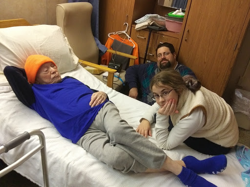 A heartfelt moment of family support in a hospital setting.