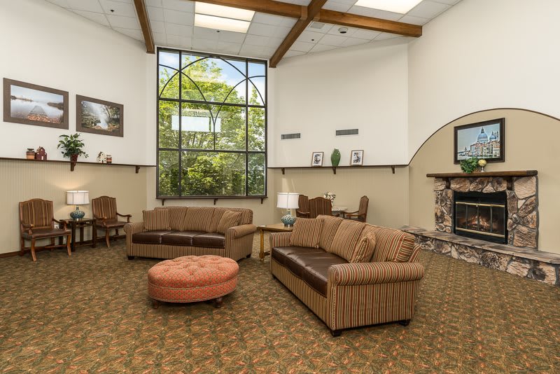 A cozy living room with comfortable sofas and a large window providing natural light.