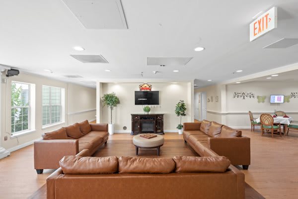 Spacious living room with comfortable seating and a television.