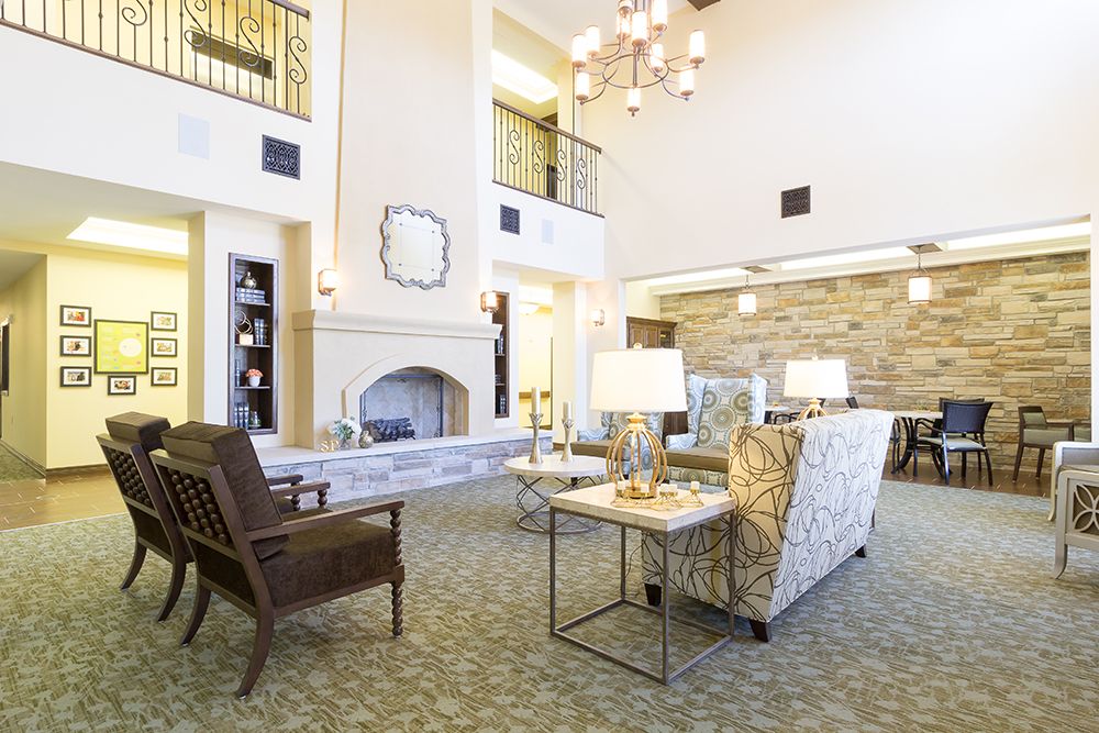 A luxurious and cozy living room with elegant decor and a grand fireplace.