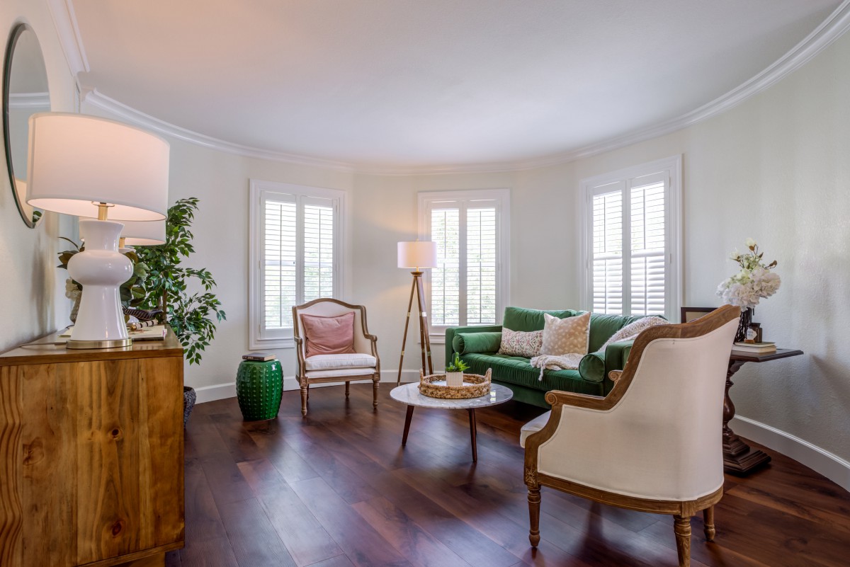A modern and cozy living room with elegant furniture and natural light.
