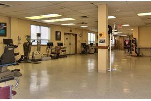 An indoor fitness facility equipped with various exercise machines.
