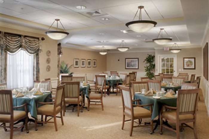 A well-decorated dining area with neatly arranged tables and comfortable seating.