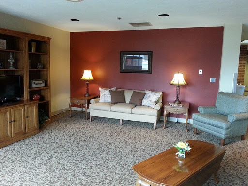 A cozy living room featuring a sofa, decorative lamps, and a coffee table.