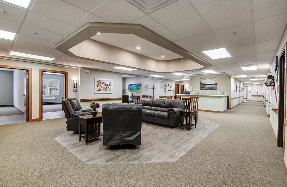 A spacious office waiting area with comfortable seating and modern decor.