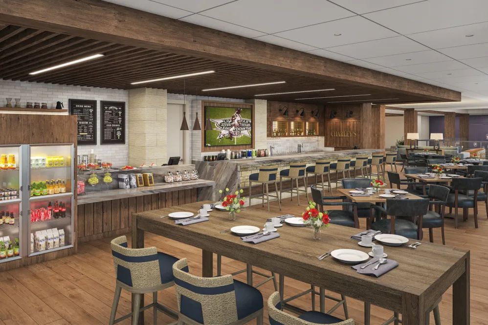 A modern restaurant interior featuring a dining area with tables, chairs, and a buffet setup.