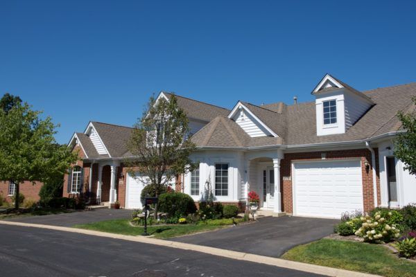 A suburban residential neighborhood featuring rows of houses with garages.