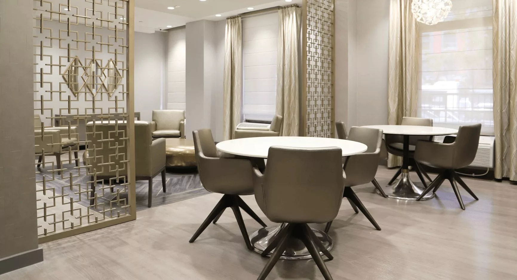 A contemporary dining area with elegant furniture and a stylish interior design.