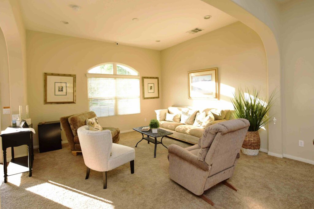 A cozy living room with comfortable seating and natural light.