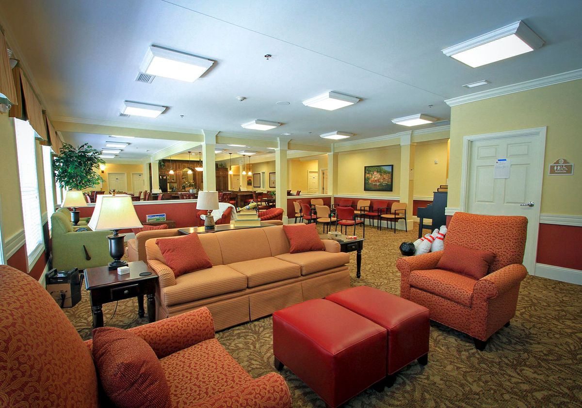A cozy lounge area with comfortable seating and warm lighting.