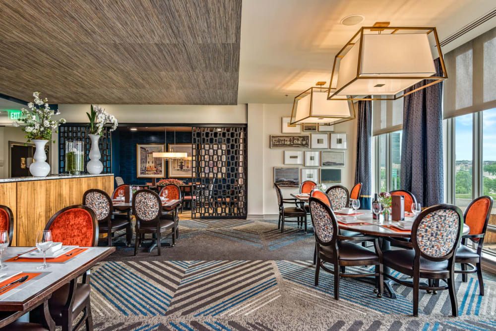 A stylish and modern restaurant interior with elegant furniture and ambient lighting.