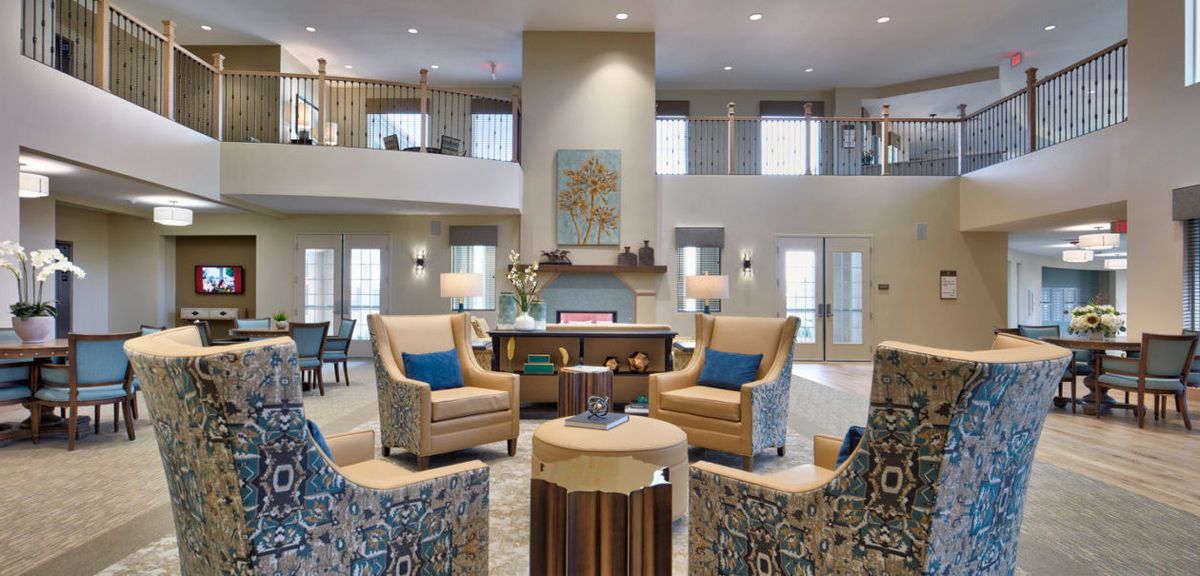 A modern and cozy living room features comfortable seating and stylish decor.