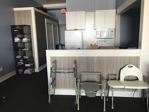 A modern kitchen area featuring various types of chairs and an organized layout.