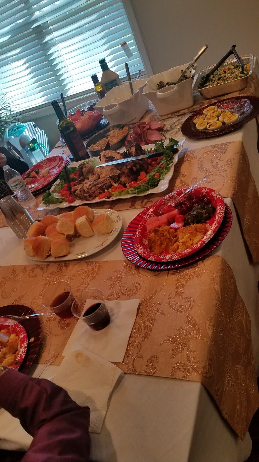 A dining table set with a variety of dishes and drinks, ready for a festive meal.