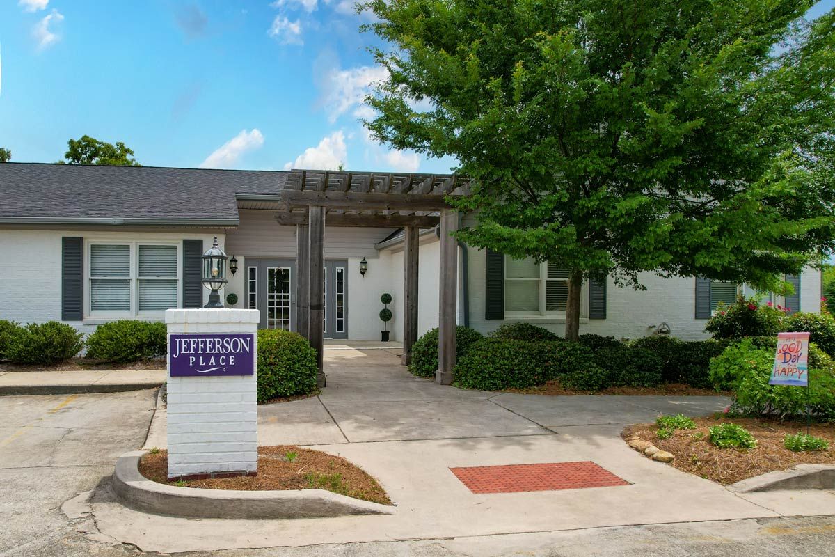 Entrance to a residential or commercial building with a sign displaying 'Leverean Flats'.