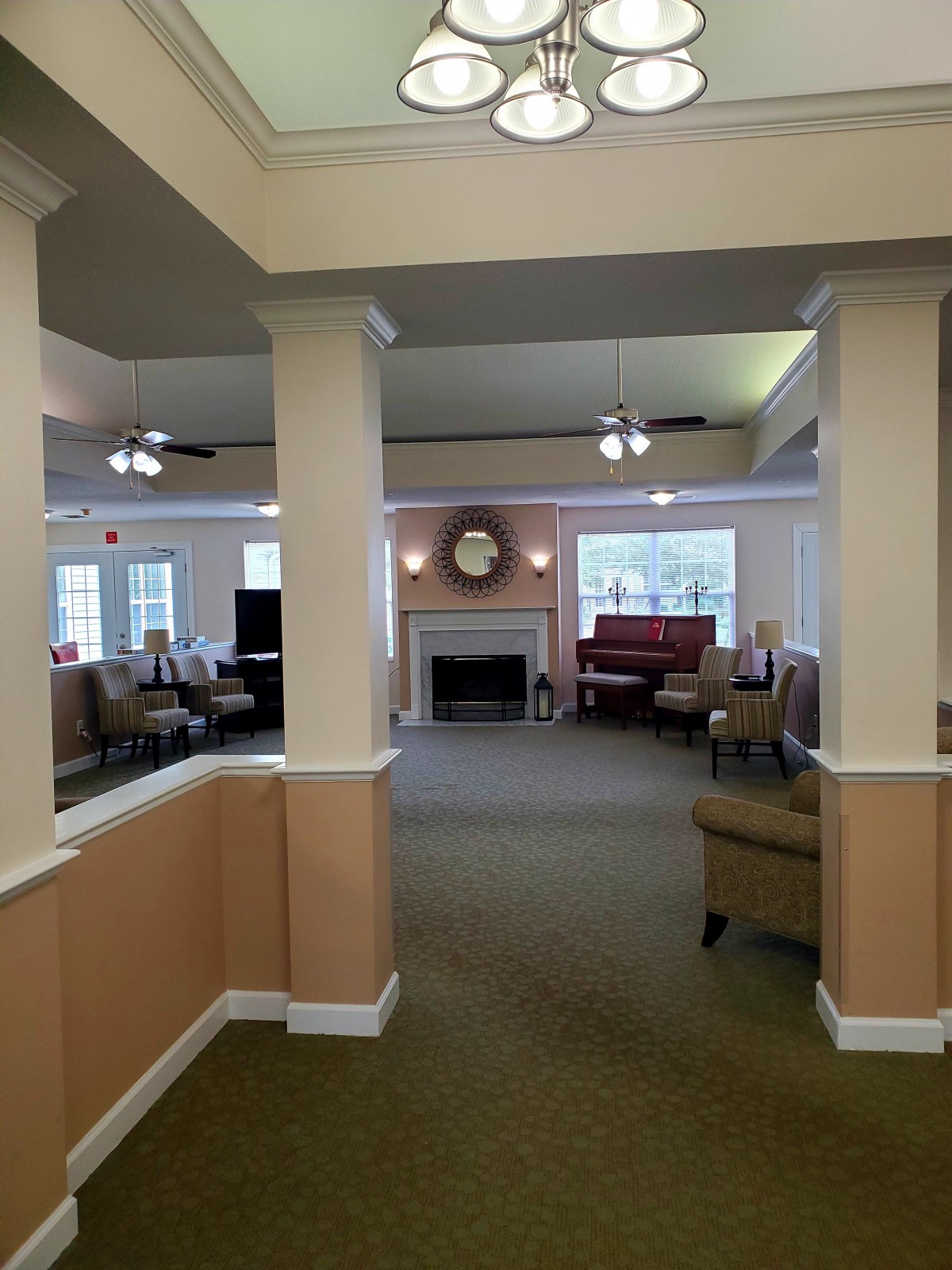 A spacious living room with a fireplace and seating area.