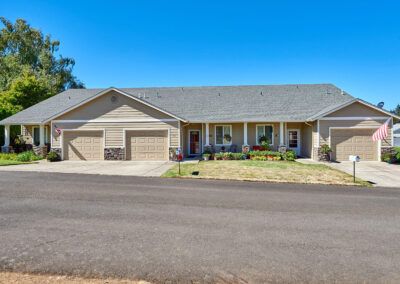 A single-story suburban house with a double garage and front porch.