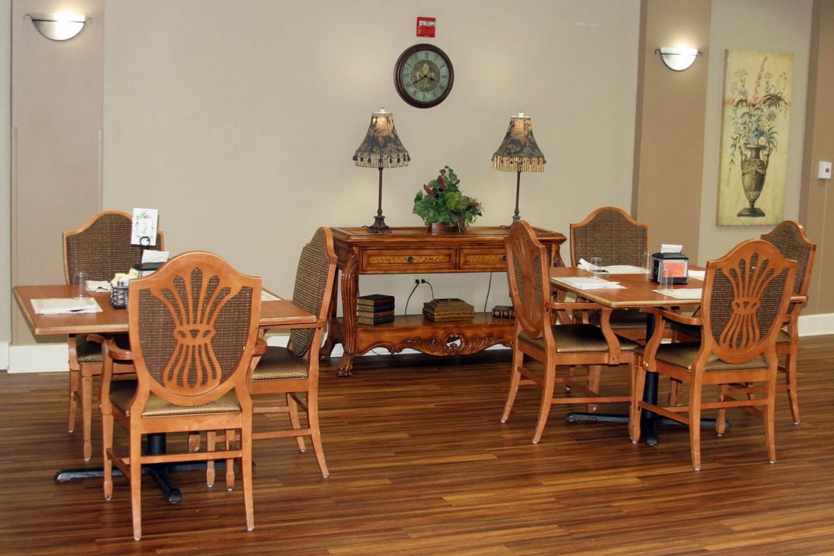 A cozy interior with wooden furniture and warm lighting.