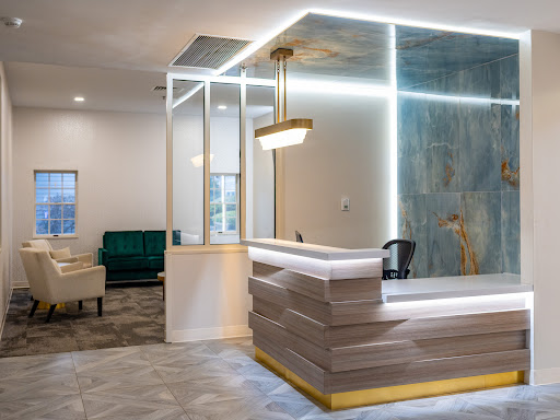 A modern reception area featuring sleek design elements and stylish furnishings.