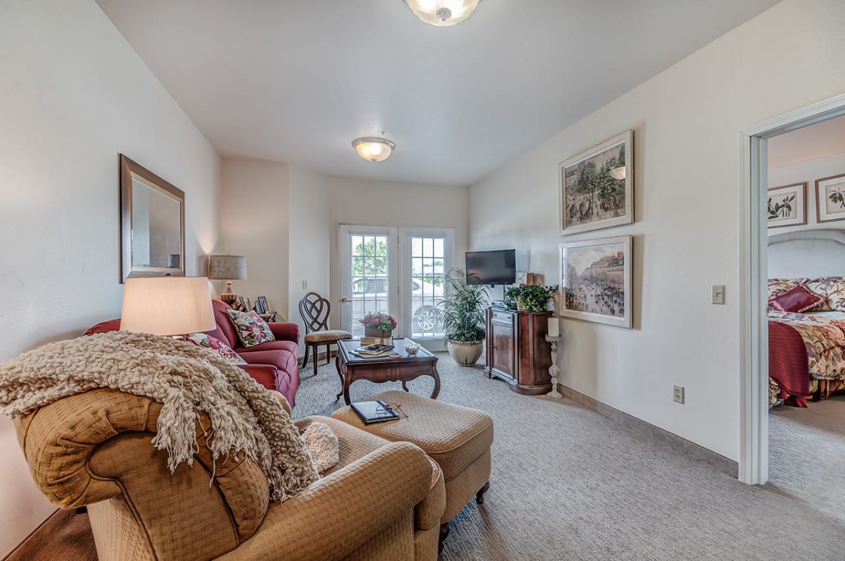 A cozy living room with comfortable seating, a coffee table, and stylish decor.