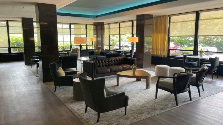 A modern hotel lobby with stylish furniture and ambient lighting.
