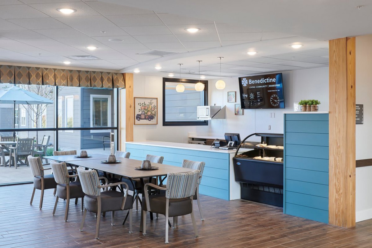 A modern dining area with stylish furniture and ambient lighting.