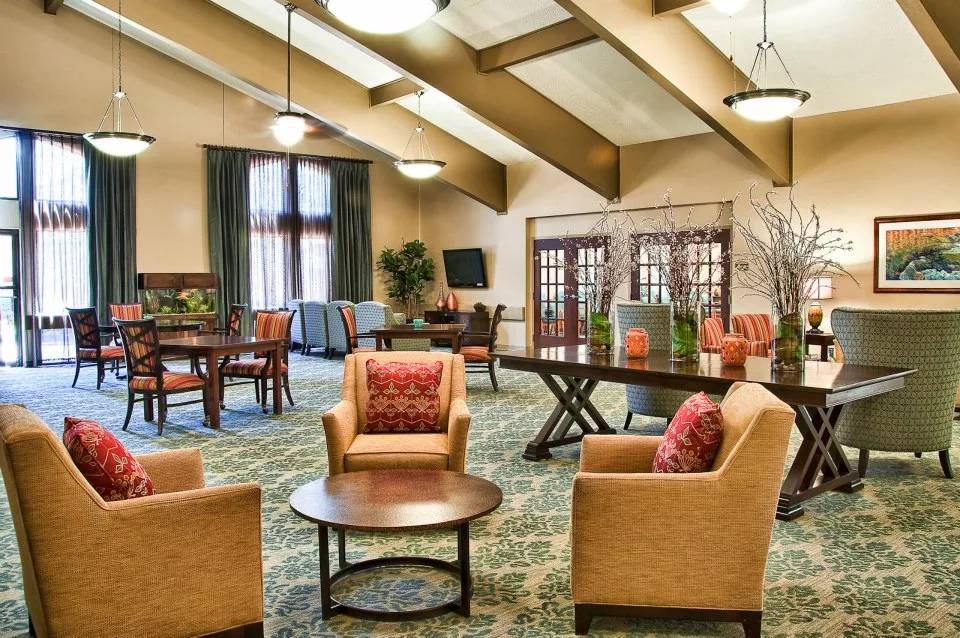 A cozy lounge area with comfortable seating and warm lighting.