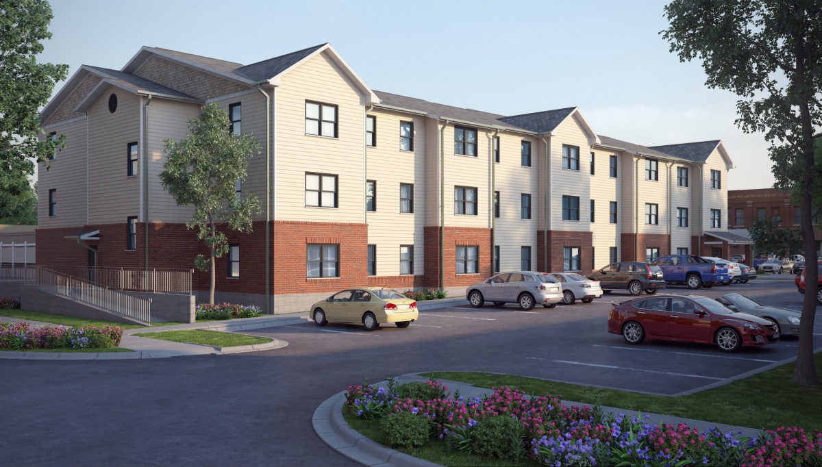 A modern multi-story apartment building with a parking lot and landscaped surroundings.