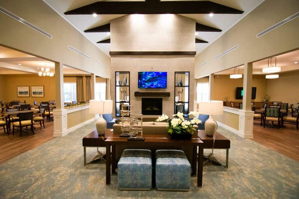 A modern living room with a fireplace, television, and stylish furniture.