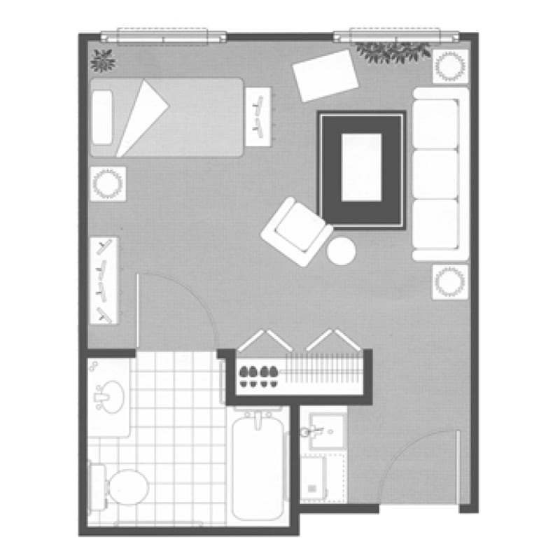A floor plan of a studio apartment featuring an open living area, kitchen, and bathroom.