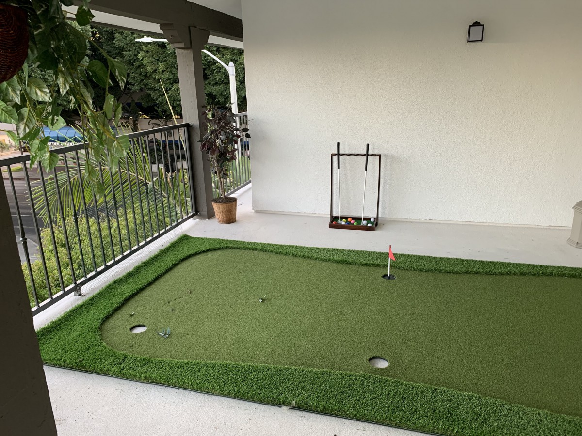 Indoor putting green setup for golf practice.