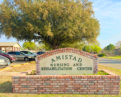 Entrance sign for Amistad Nursing and Rehabilitation Center.