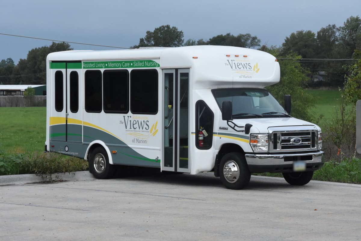 A shuttle bus parked on the road.