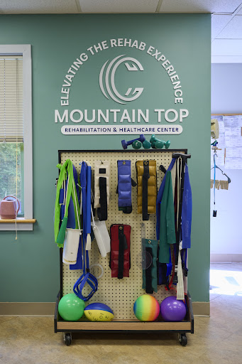 A display of various fitness and rehabilitation equipment at Mountain Top Wellness Center, promoting health and active living.