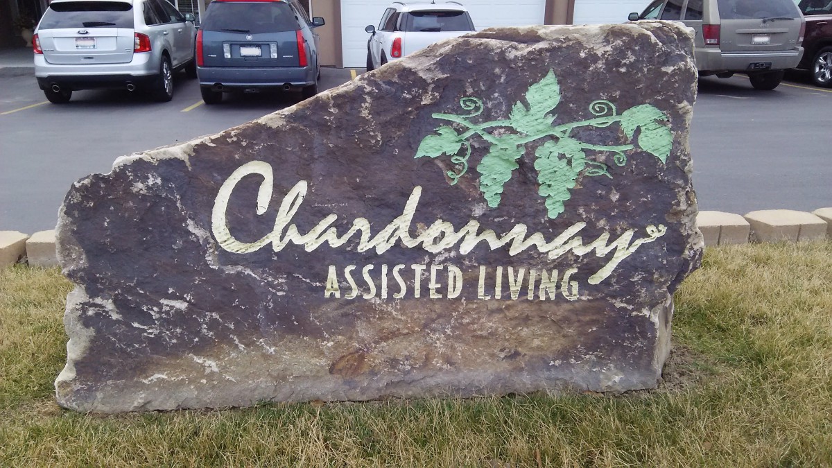 A stone sign for Chardonnay Assisted Living facility.