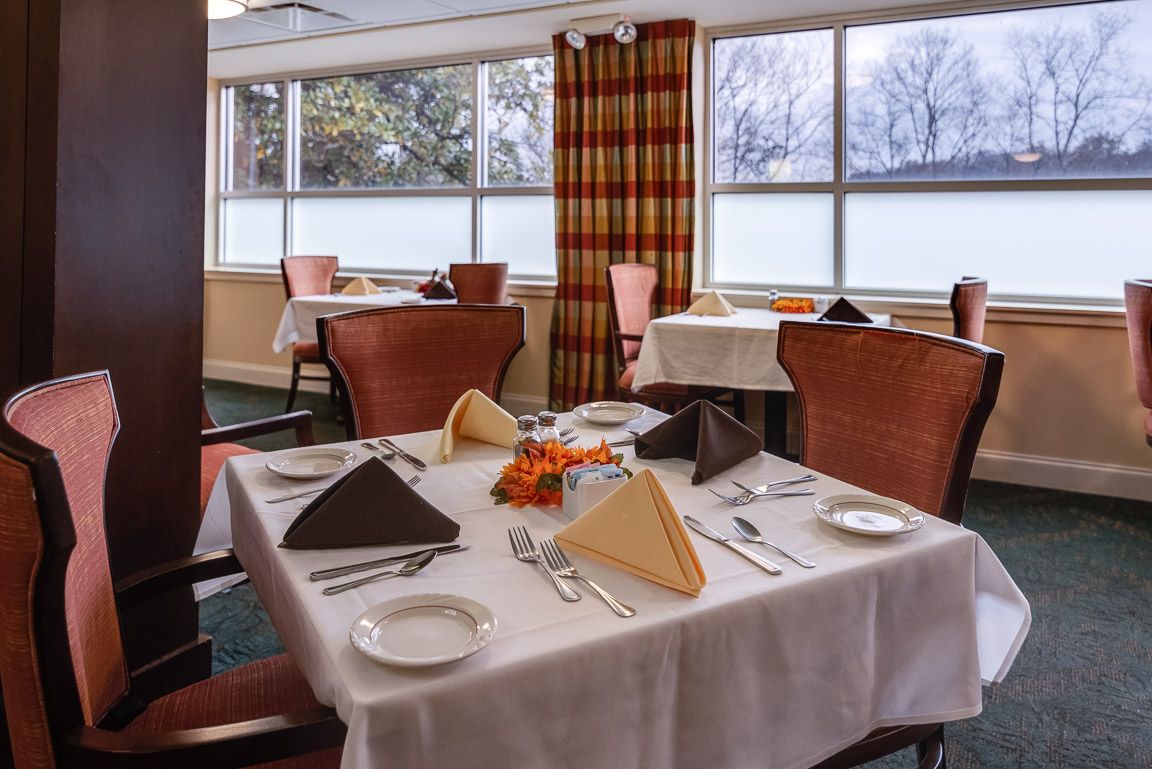 Elegant dining area with neatly set tables and warm decor.