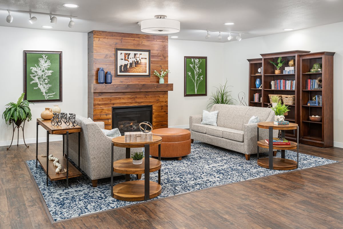 A modern living room with a cozy fireplace, comfortable sofas, and stylish decor.